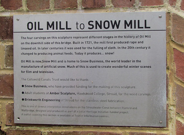This photograph shows an aluminium plaque which describes the mill here.