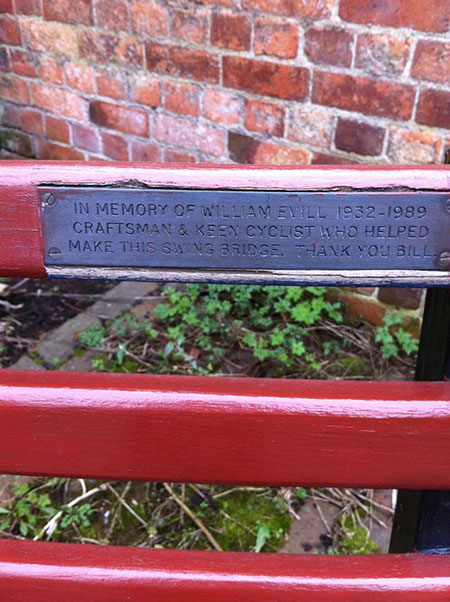 Small plaque on the back of a bench at the canalside.